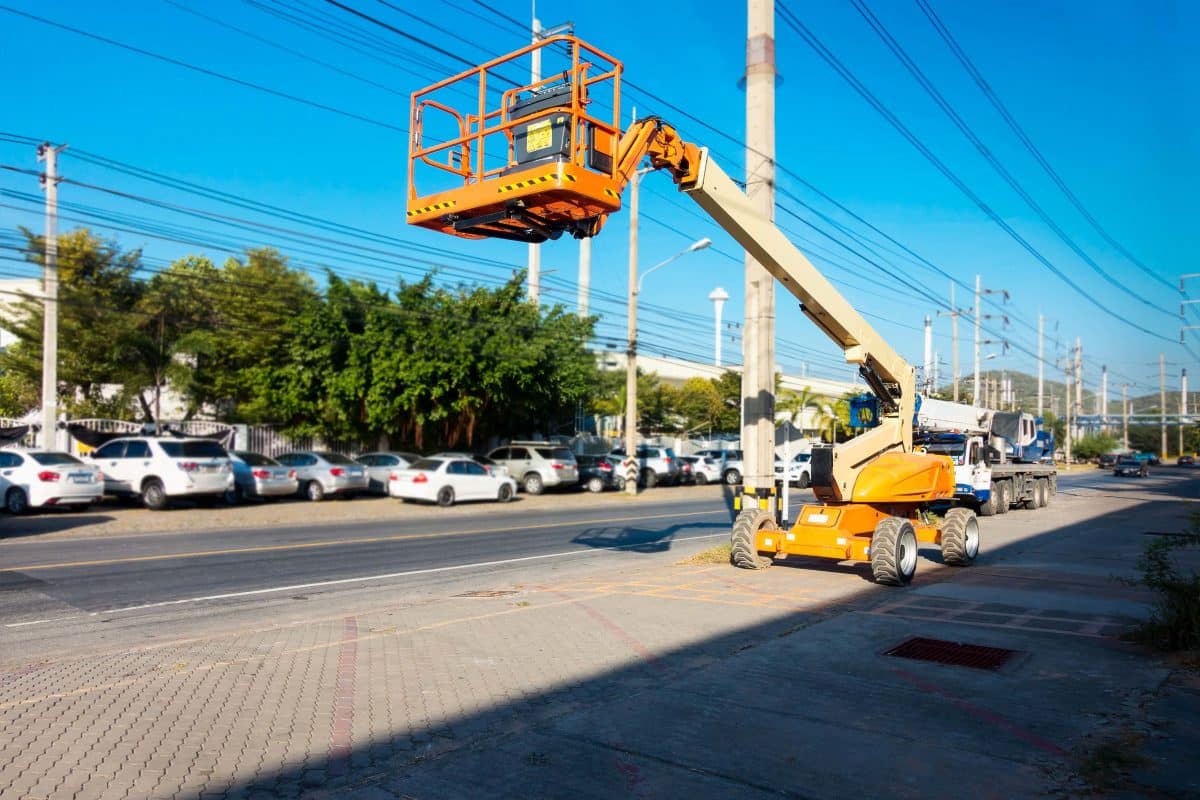 Lifting boom lift in construction site