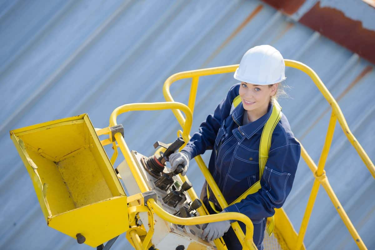 Woman in cherry picker bucket
